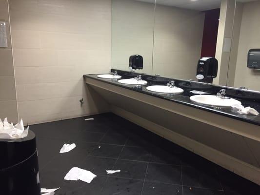 The ladies room, trash overflowing.