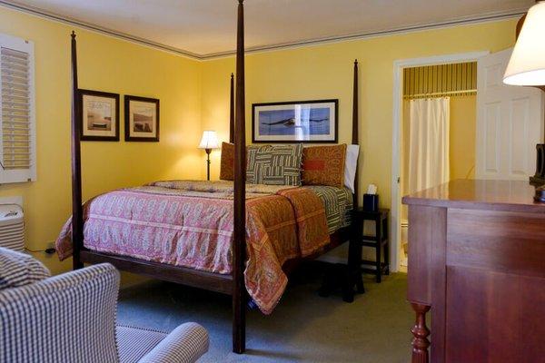 The Aeries room offers a more masculine decor and features a four-poster bed, and access to the screened-in porch.