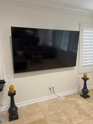 Tv mount job with concealed cables running behind the wall