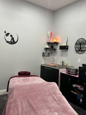 Massage room with option to get hot stone or cupping therapy, as well cavitation treatment