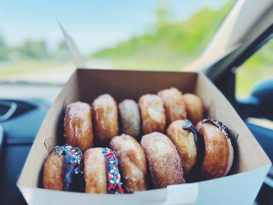 Dozen donuts: chocolate with sprinkles, toasted coconut, cinnamon sugar, old fashioned, glazed, apple, blueberry, Oreo