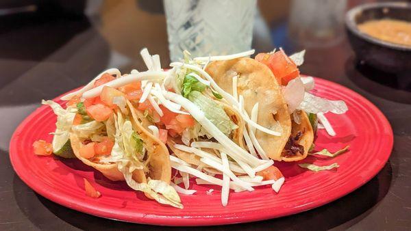 Happy hour chicken tacos and margarita.