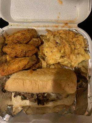 Philly cheesesteak combo with hot lemon pepper wings and cheese fries