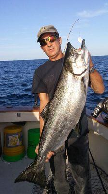 Captain john with a nice king salmon .