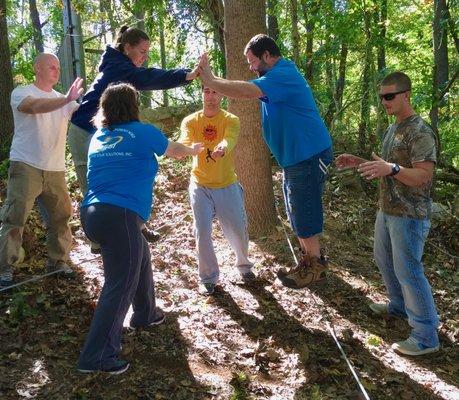 Traversing the Trust V - a team trust exercise at the Randallstown Ropes Course.