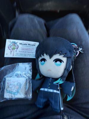 I got a Demon Slayer plush and some stickers and some Demon Slayer rings or hair accessories idk know what they are but there all super cute