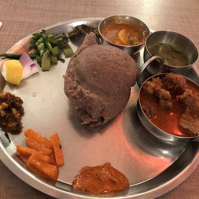 Goat Dhendo (millet polenta) with goat, veggies, achar