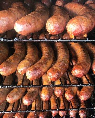 Many varieties of Smoked Sausages made fresh in house. Pictured: Bacon Cheddar Sausage