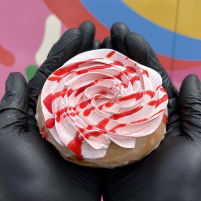 The Raspberry Fool. Our classic glazed donut topped with raspberry cream and drizzle!