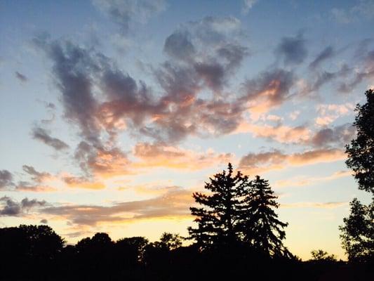 Sunset from my seat on the outdoor sofa while sipping wine