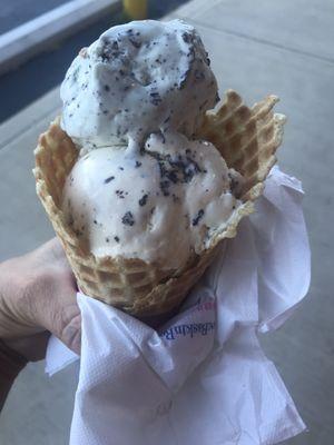 One scoop Mint Chocolate Chip one scoop Chocolate Chip in a waffle cone