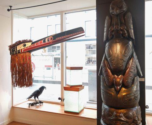 Huxwhuku Mask by Roy Speck, Raven bronze by Marvin Oliver, Glass bentwood boxes by Alano Edzerza, Bronze totem pole by Preston Singletary.