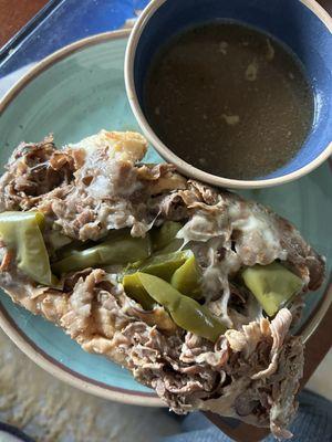 Beef w/ cheese & sweet peppers. 2 au jus sides in a bowl to dip