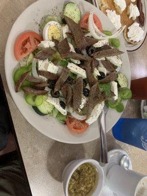 Greek salad with gyro meat. Fresh feta and lots of veggies. Dressing was on the side.