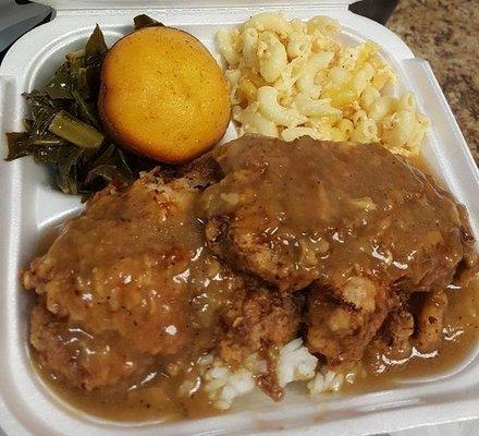 Smothered pork chop from lil cee's