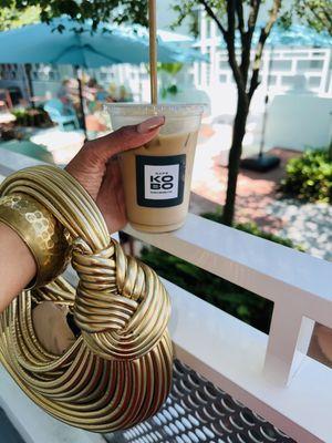 Iced vanilla latte with oat milk