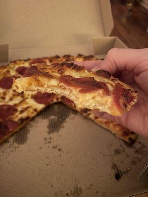 "Hand tossed" pepperoni with "extra sauce". Where's the sauce? Where's the hand-tossed crust? More like thin crust.