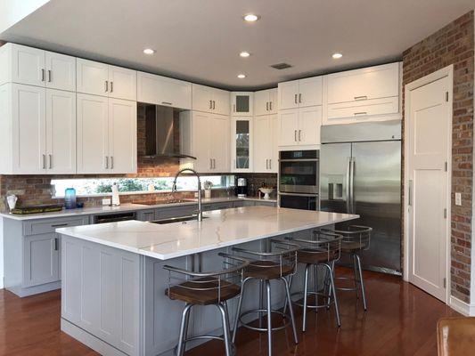 White shaker upper cabinets with gray bottom cabinets