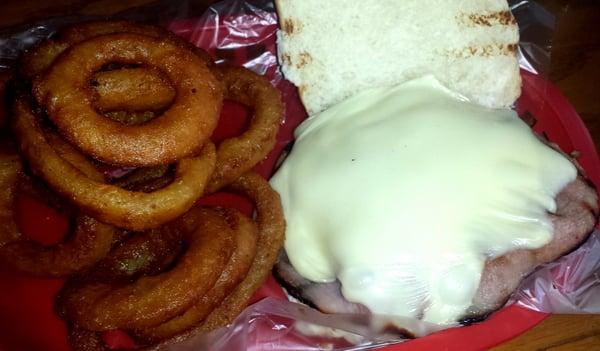 Burger with shave ham, swiss, and o-rings.