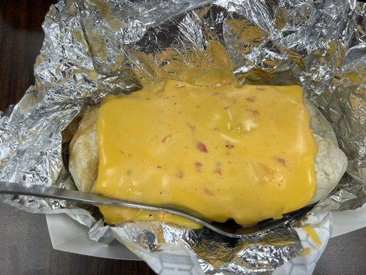 Burrito special. Shredded beef, beans, rice, and cheese