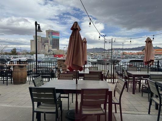 Outdoor large patio with umbrellas for sunny day.