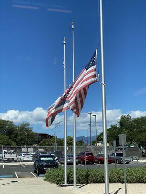 Outside the Entrance to the HAL Maintenace Hangar and Credit Union. Flag at half mast to honor 9-11 Patriots