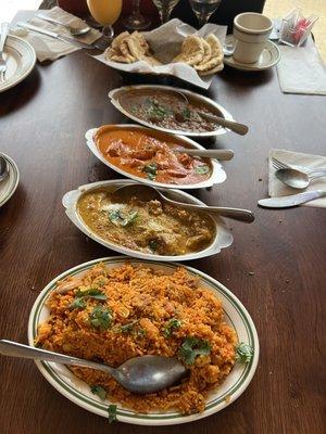 Bottom to Top: Chicken Biryani, Fish Rheshmi, Chicken Tikka Masala, Lamb Curry, and Garlic Naan