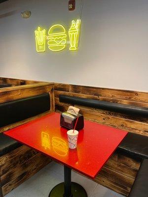 Indoor seating and neon sign