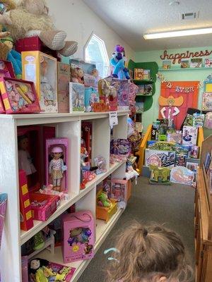 Dolls, games, and workbooks are in this area.