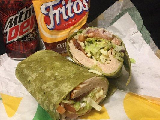 turkey bacon guacamole in a spinach wrap, mozzarella cheese, lettuce,  tomato, onion, green peppers, pickles and ranch dressing.