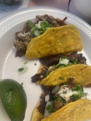 Fajita & Trompo Tacos with burnt cheese.