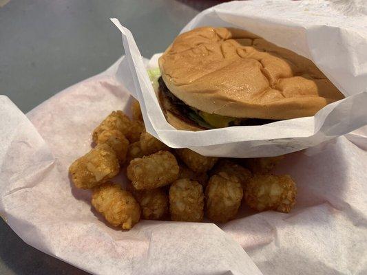 Double cheeseburger with double cheese (typically comes with one slice of cheese) and large order of tator tots.