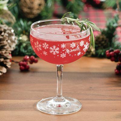 CHRISTMAPOLITAN - Grey Goose Vodka, St. Germain Elderflower Liqueur, Noilly Prat Dry Vermouth, Spiced Cranberry Sauce, Rosemary, Lime, Absin