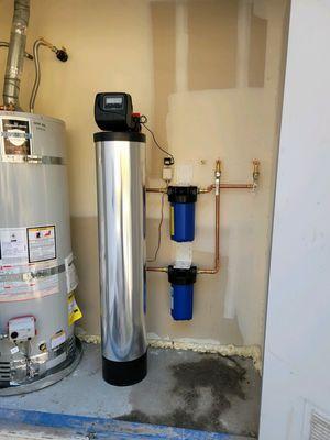 Krystal Klear Whole House Water Treatment System installed in garage.