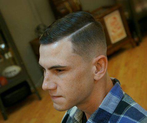 Mid skin fade with hard part