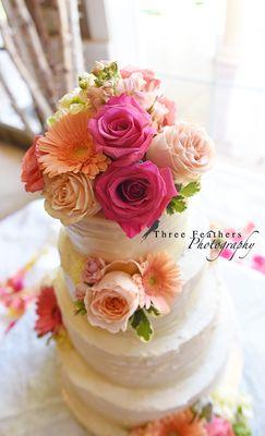 The cake! Who needs a topper when you can have flowers. Photo by Three Feathers Photography.