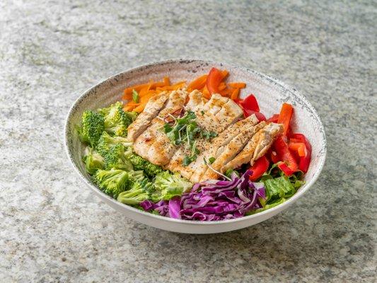 Thai crunch salad with broccoli, red peppers, red cabbage, carrots and scallions over greens tossed in Sesame Ginger Vinaigrette