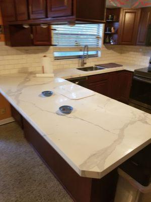 My new quartz countertops and new sink and faucet.