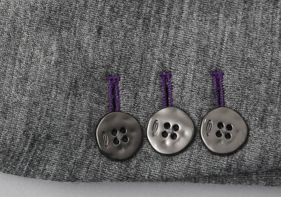 One of a kind Metal buttons to enhance your look with Purple buttons holes on this Silk and Wool Knit Blazer.