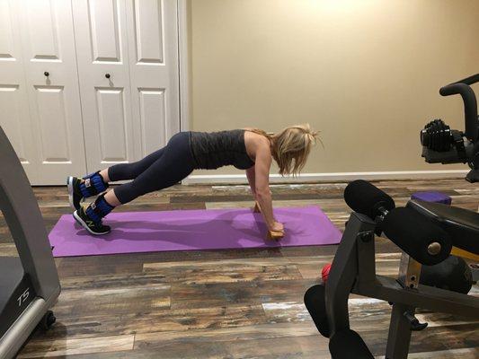 Weighted leg up pushup on a shena board