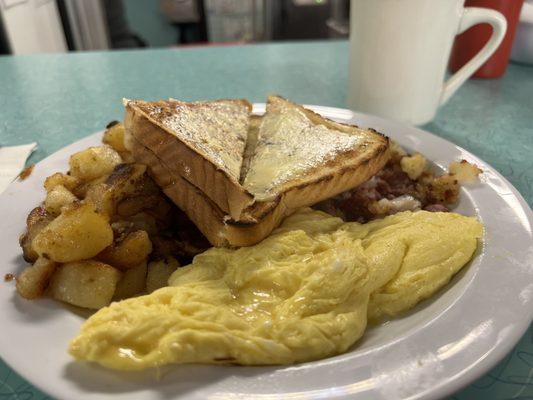 2 eggs, home fries, toast & hash. They got the extra butter on the toast, and they got scrambled-soft perfect!