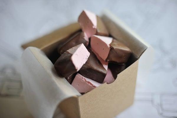 Rose Cardamom Marshmallow half dipped in Belgian Milk Chocolate