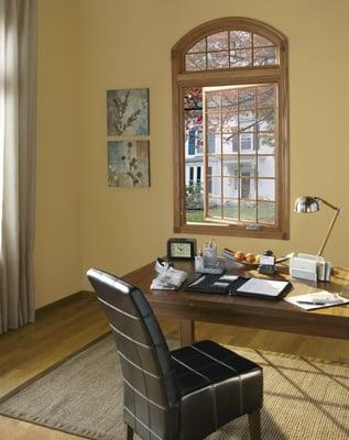 Casement window and an arch window with colonial style grilles