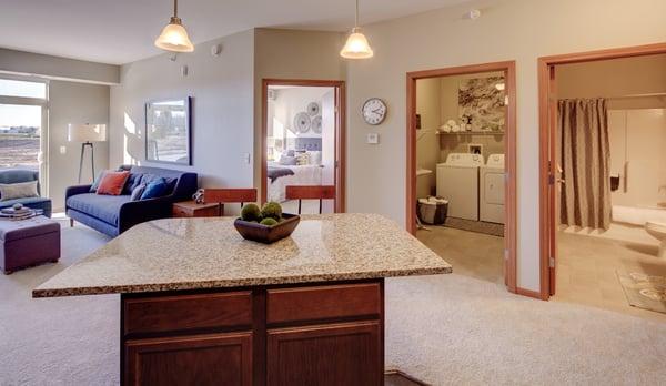 Kitchen, looking into bedroom and laundry room