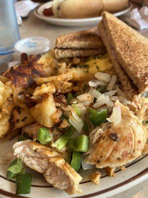 Greek souvlaki breakfast platter - eggs, chicken, home fries and toast. Plenty of protein.