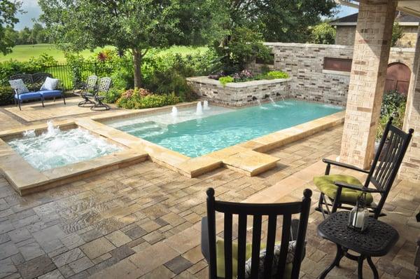 Pool and spa with a splash pad for the little ones.