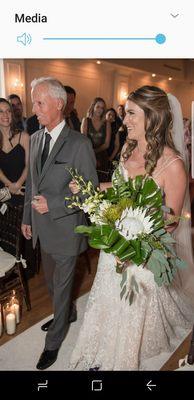 Our beautiful bride curing a unique bridal bowkay constructed with king protea.