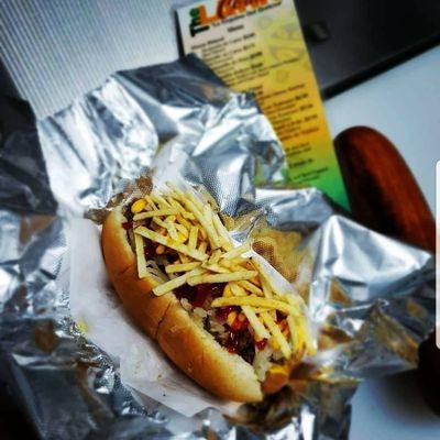 Hot Dog Boricua: Topped with seasoned ground beef, sauerkraut, cheese, ketchup, mustard, potato sticks