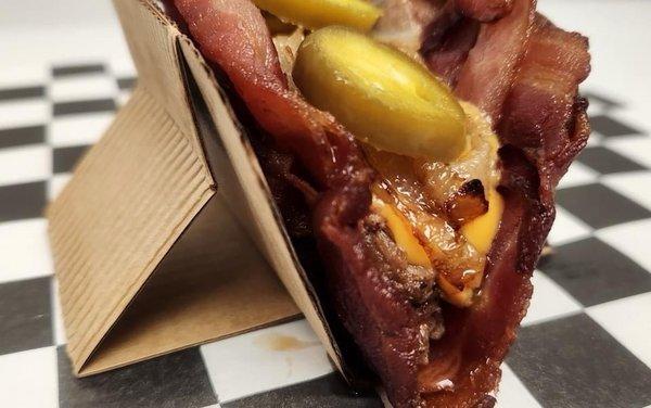 A taco shell made of bacon, filled with brisket! Not a regulation menu item, though.