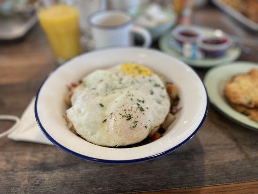 Under these over-medium eggs lies a hash of corned-beef joy.